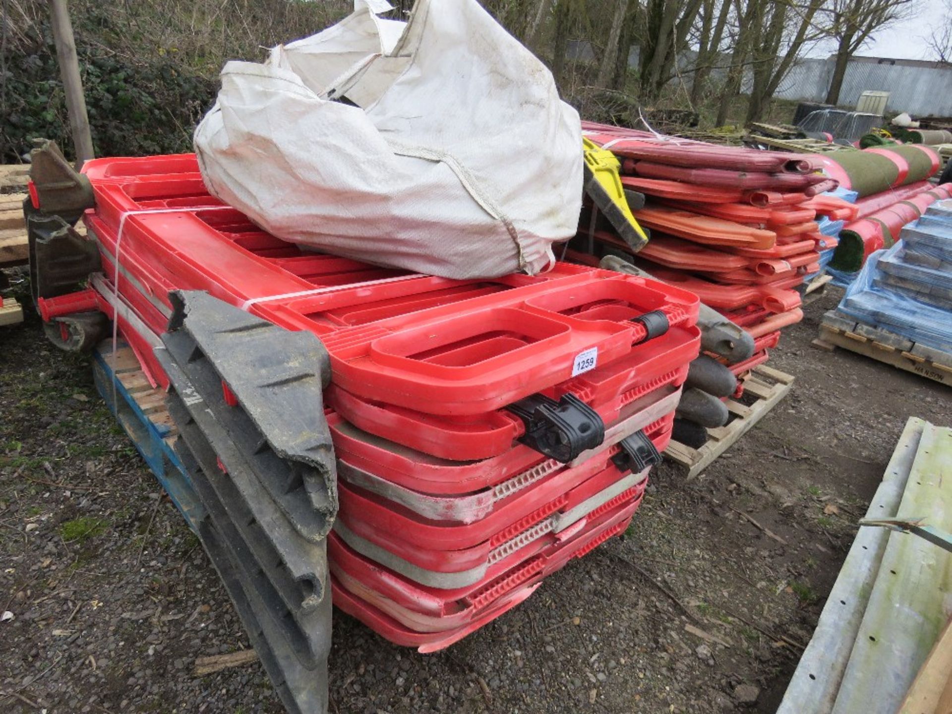 2 X STACKS OF PLASTIC ROAD CHAPTER 8 BARRIERS, 30NO APPROX. THIS LOT IS SOLD UNDER THE AUCTIONEER