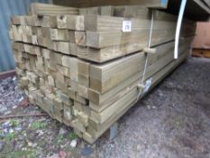 LARGE BUNDLE OF TREATED TIMBER POSTS, MAINLY 2.4 -2.7M LENGTH X 55MM X 45MM APPROX: 180NO IN TOTAL A