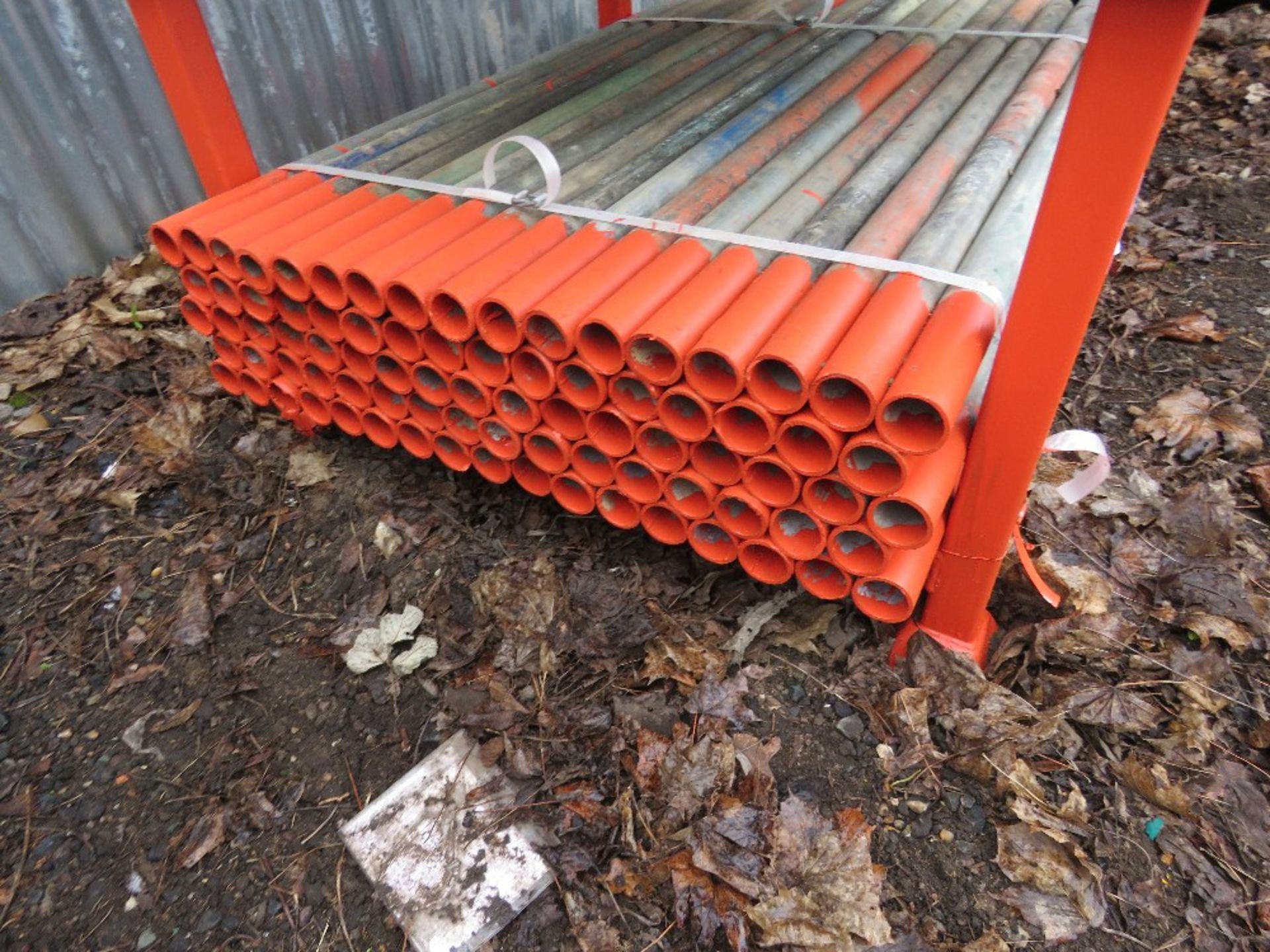 STILLAGE CONTAINING SHORT SCAFFOLD TUBES, 4-5FT LENGTH , 83NO IN TOTAL APPROX. THIS LOT IS SOLD