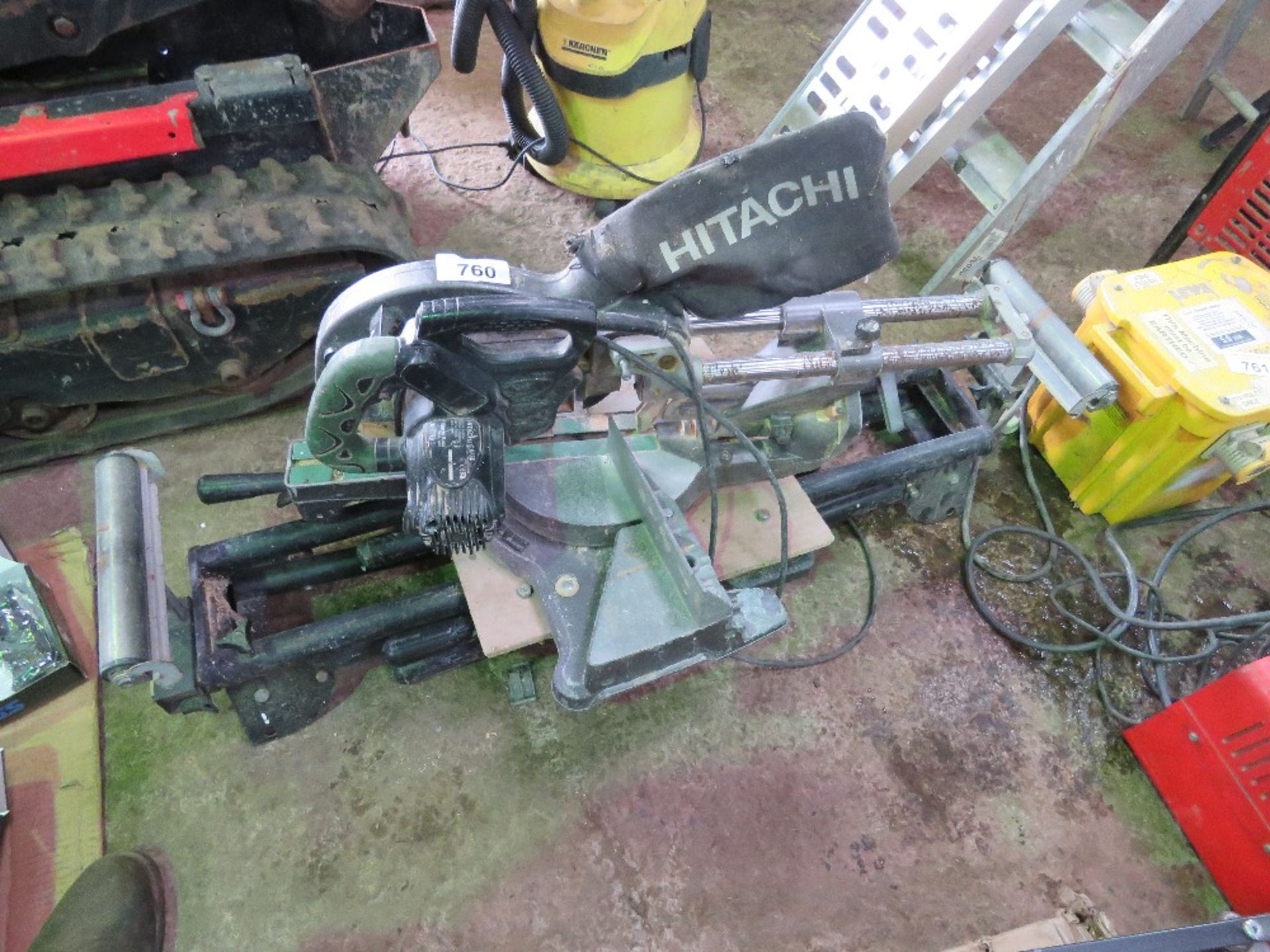 HITACHI 240VOLT POWERED CROSS CUT MITRE SAW PLUS STAND. OWNER RETIRING AND EMMIGRATING. THIS LOT I