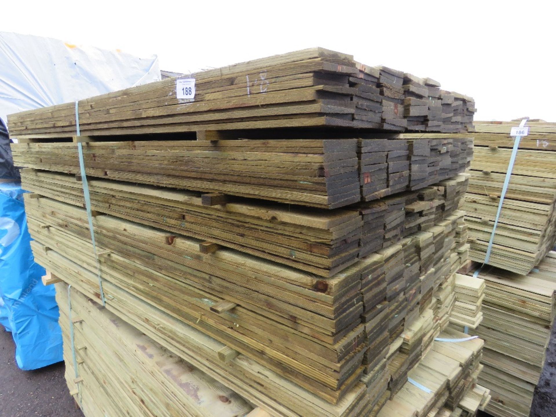 LARGE PACK OF TREATED FEATHER EDGE TIMBER FENCE CLADDING BOARDS: 100MM WIDTH @ 1.8M LENGTH APPROX.