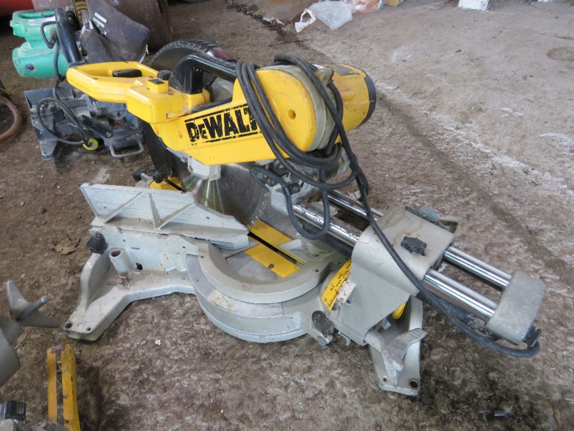 DEWALT PROFESSIONAL SLIDING HEAD 240VOLT POWERED MITRE SAW. THIS LOT IS SOLD UNDER THE AUCTIONEER