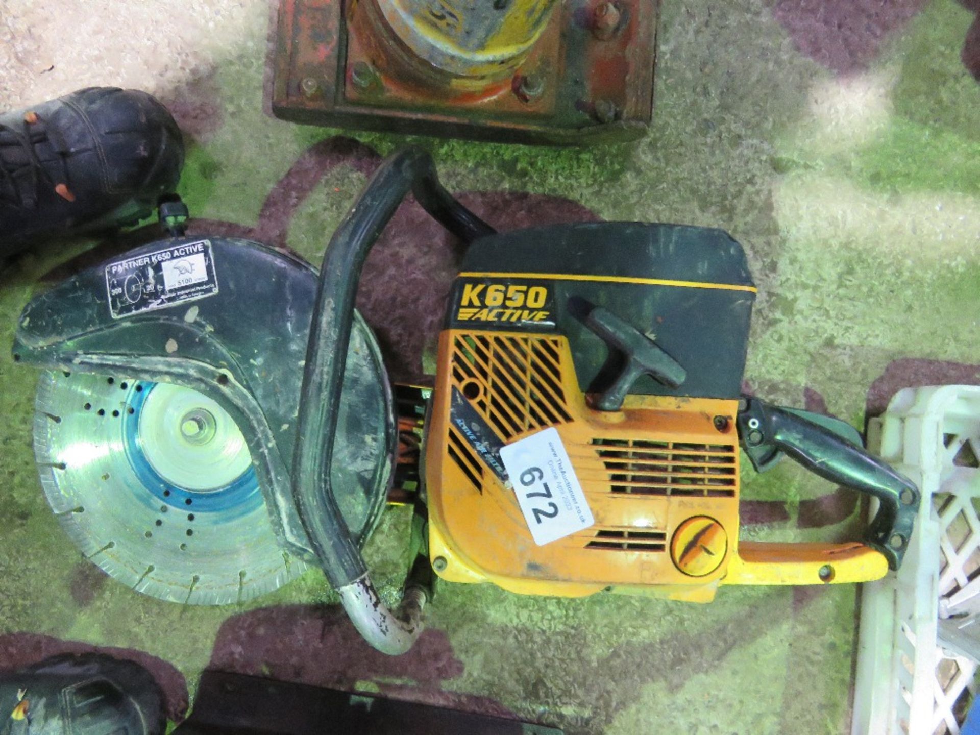 PARTNER K650 PETROL SAW WITH A BLADE. THIS LOT IS SOLD UNDER THE AUCTIONEERS MARGIN SCHEME, THERE