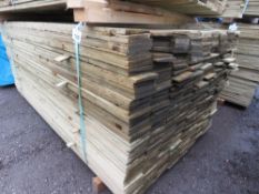 LARGE PACK OF TREATED FEATHER EDGE TIMBER FENCE CLADDING BOARDS: 100MM WIDTH @ 1.8M LENGTH APPROX.