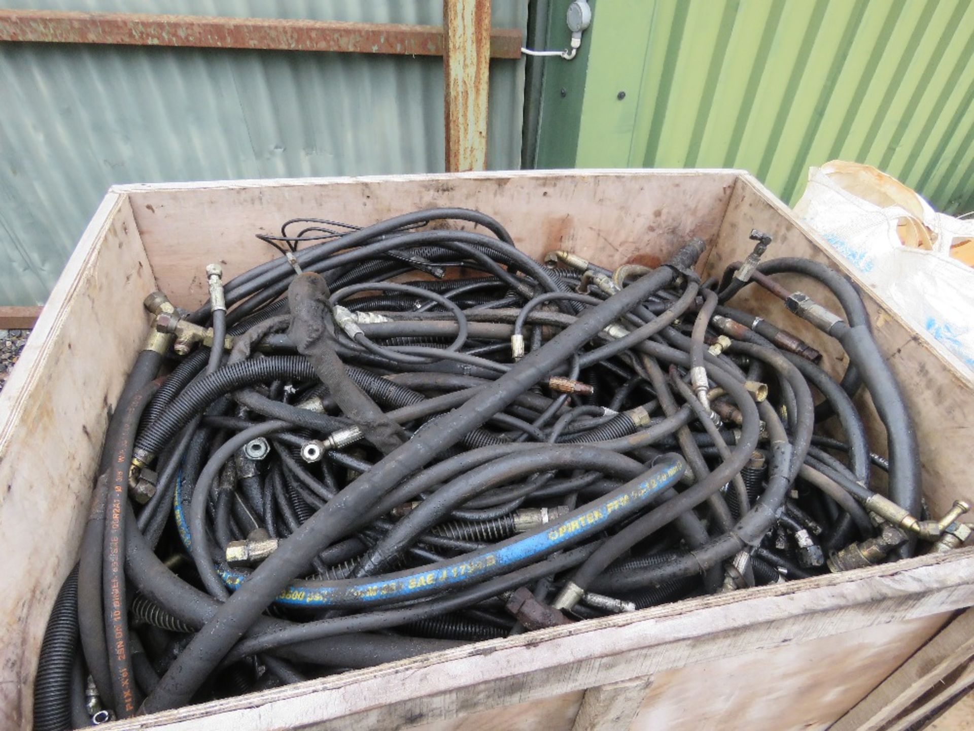 STILLAGE CONTAINING A LARGE QUANTITY OF ASSORTED HYDRAULIC HOSES.