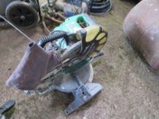 HITACHI 110VOLT POWERED MITRE SAW. THIS LOT IS SOLD UNDER THE AUCTIONEERS MARGIN SCHEME, THEREFOR