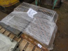PALLET OF GULLEY GRATES AND MANHOLE COVERS.