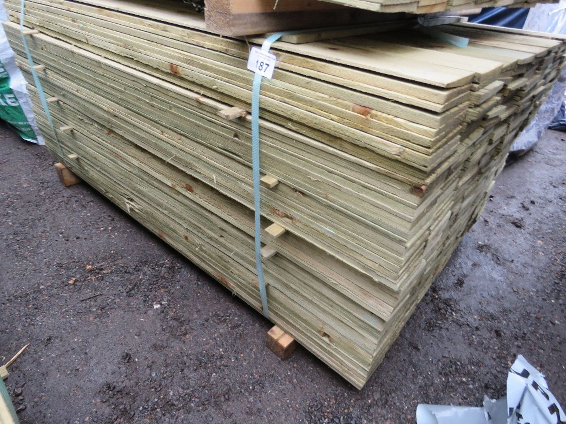 LARGE PACK OF TREATED FEATHER EDGE TIMBER FENCE CLADDING BOARDS: 100MM WIDTH @ 1.8M LENGTH APPROX.