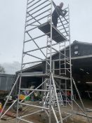 BOSS DOUBLE WIDTH SCAFFOLD TOWER WITH OUTRIGGERS AND LEGS AND BOARDS. THIS LOT IS SOLD UNDER THE