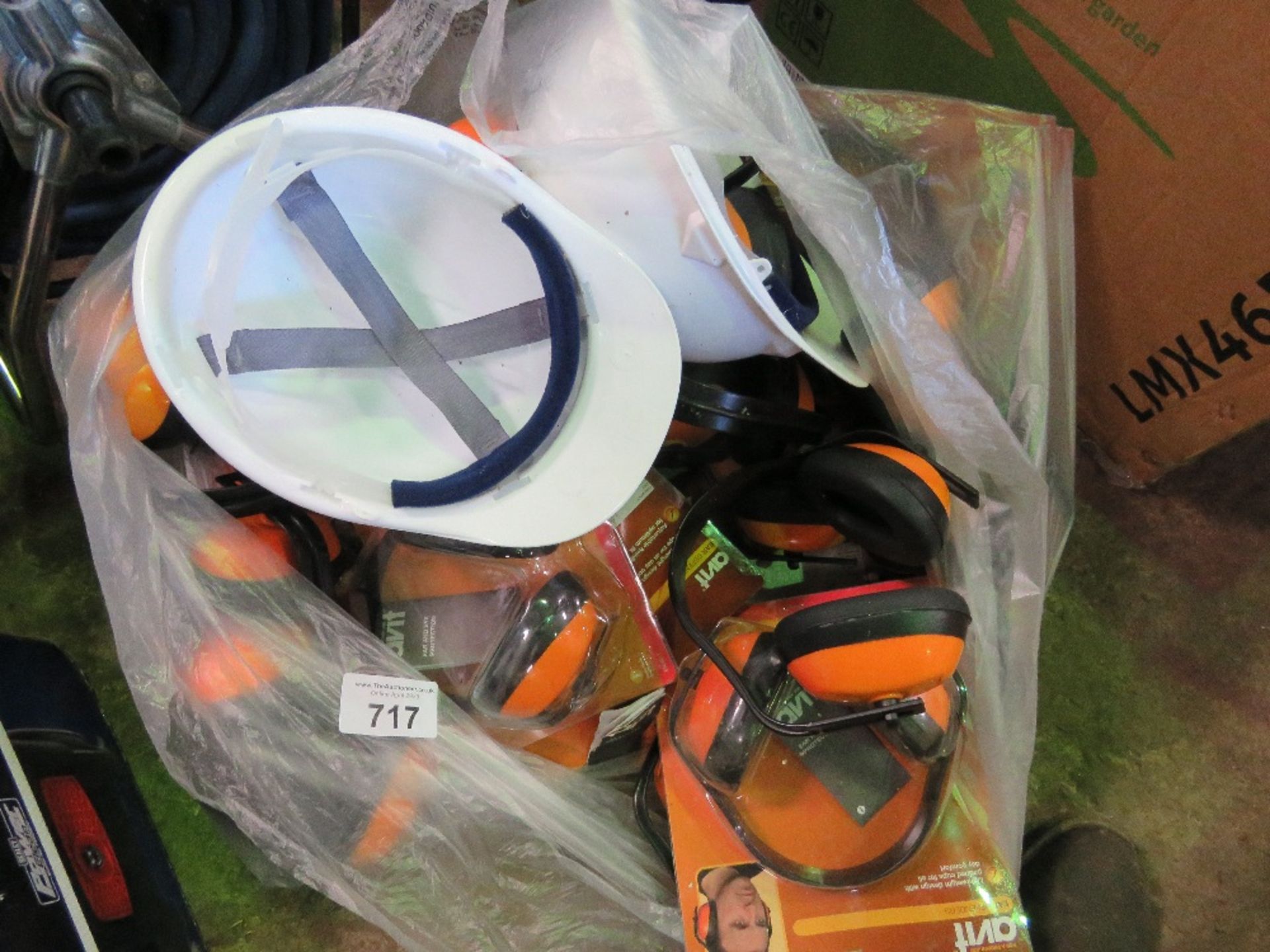 UNUSED EAR MUFFS AND PROTECTIVE HELMETS.