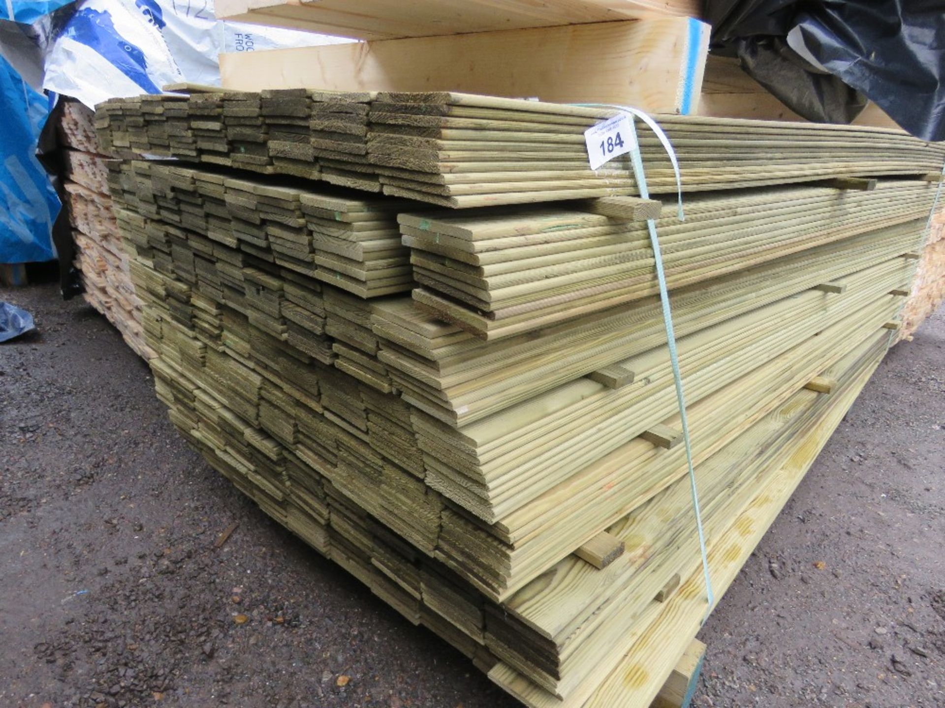 LARGE PACK OF TREATED HIT AND MISS TIMBER FENCE CLADDING BOARDS: 100MM WIDTH @ 1.75M LENGTH APPROX.