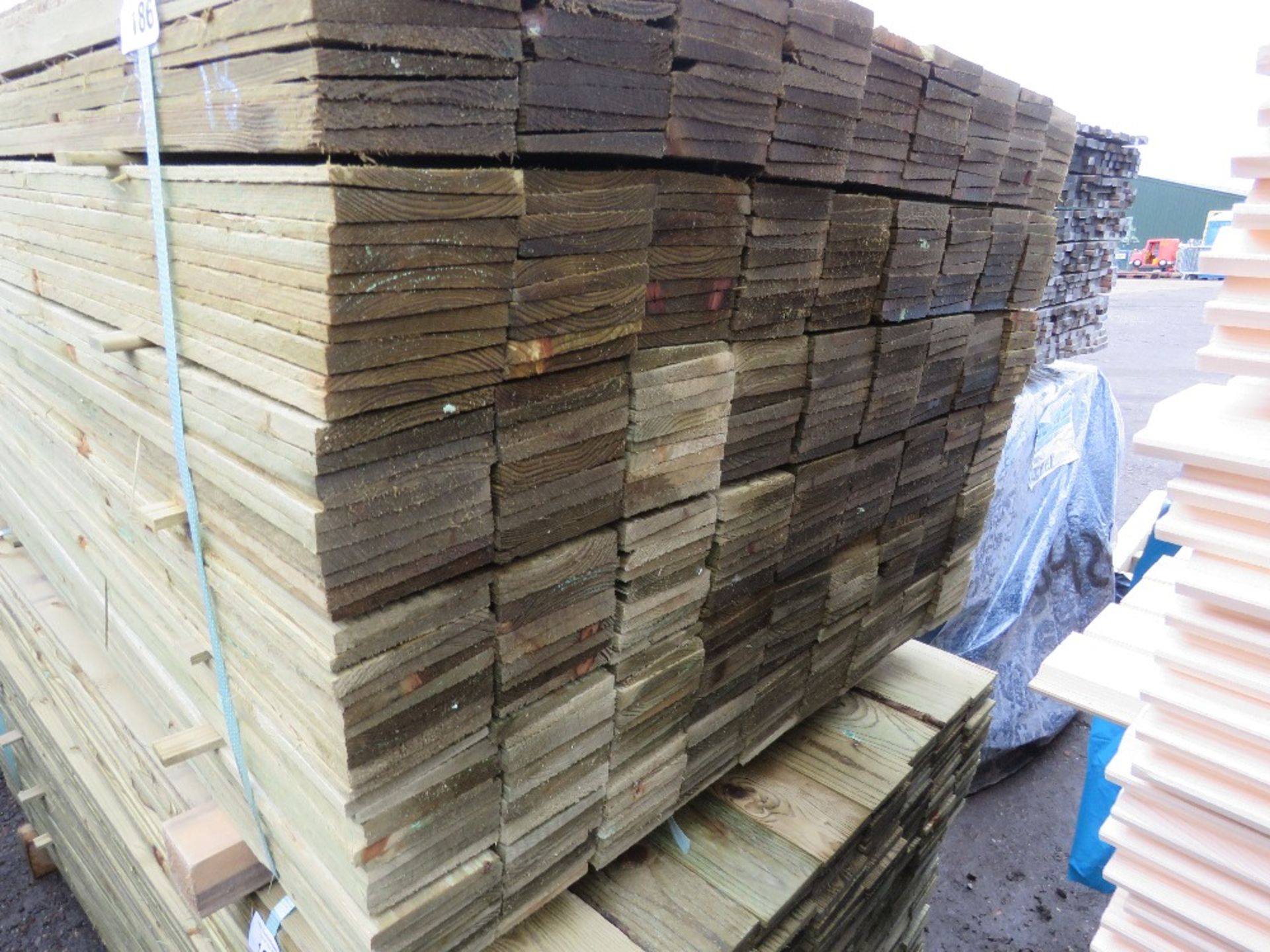 LARGE PACK OF TREATED FEATHER EDGE TIMBER FENCE CLADDING BOARDS: 100MM WIDTH @ 1.8M LENGTH APPROX. - Image 2 of 3