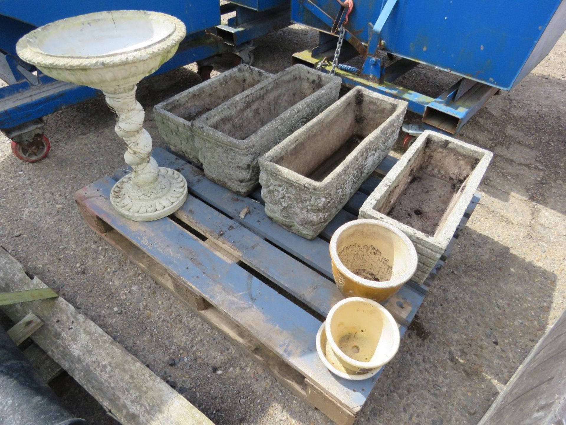 PALLET CONTAINING BIRD BATH, ASSORTED PLANTERS PLUS A PLASTIC STORAGE BIN. THIS LOT IS SOLD UNDER