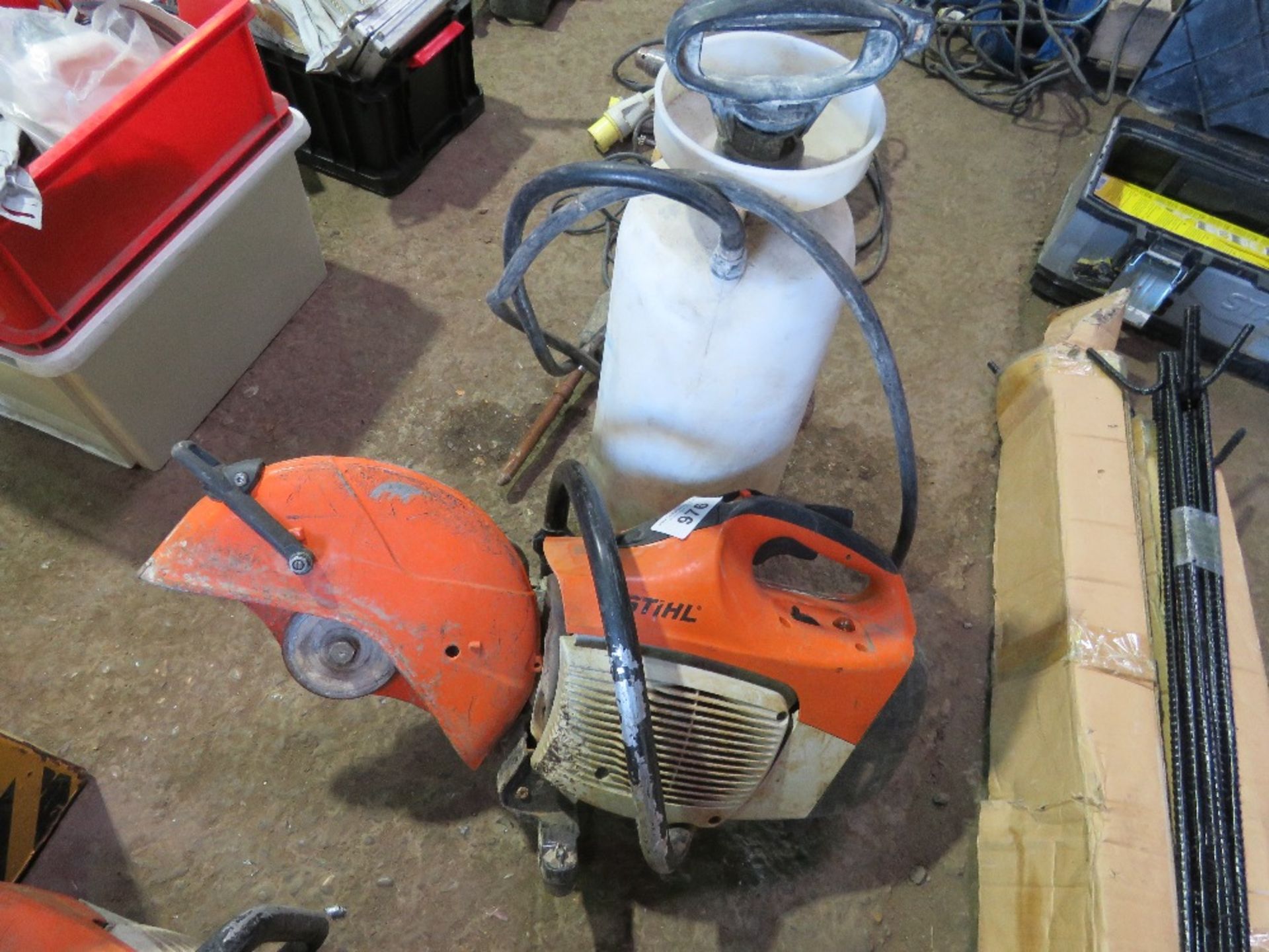 STIHL TS410 TYPE PETROL CUT OFF SAW PLUS A WET CUT BOTTLE. THIS LOT IS SOLD UNDER THE AUCTIONEERS