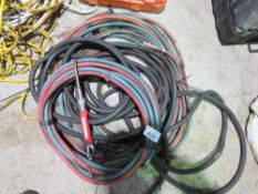 AIR AND GAS HOSES PLUS A WELDING GUN.