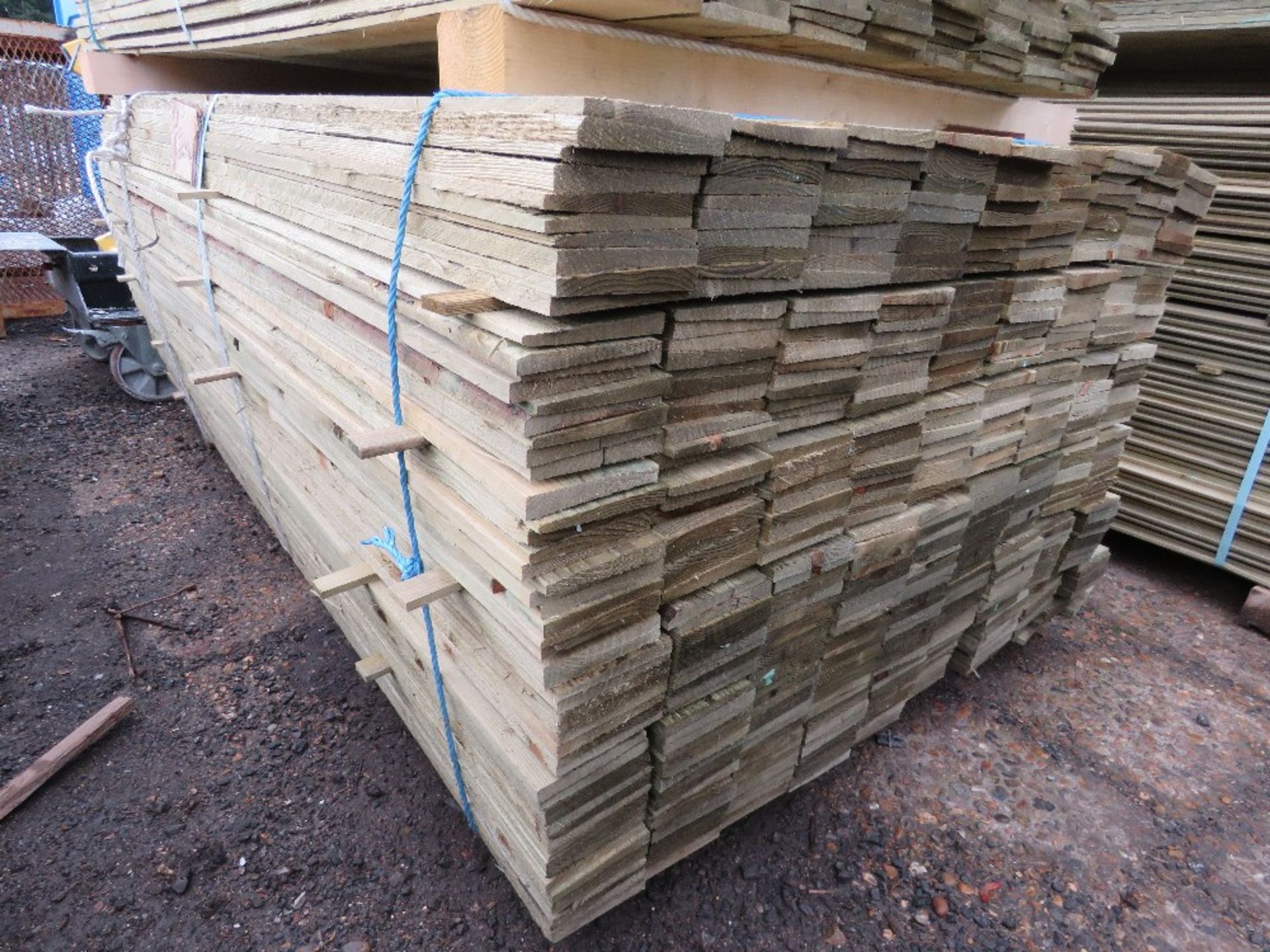 LARGE PACK OF TREATED FEATHER EDGE CLADDING BOARDS, MAJORITY ARE 1.83M LENGTH X 100MM WIDTH APPROX.