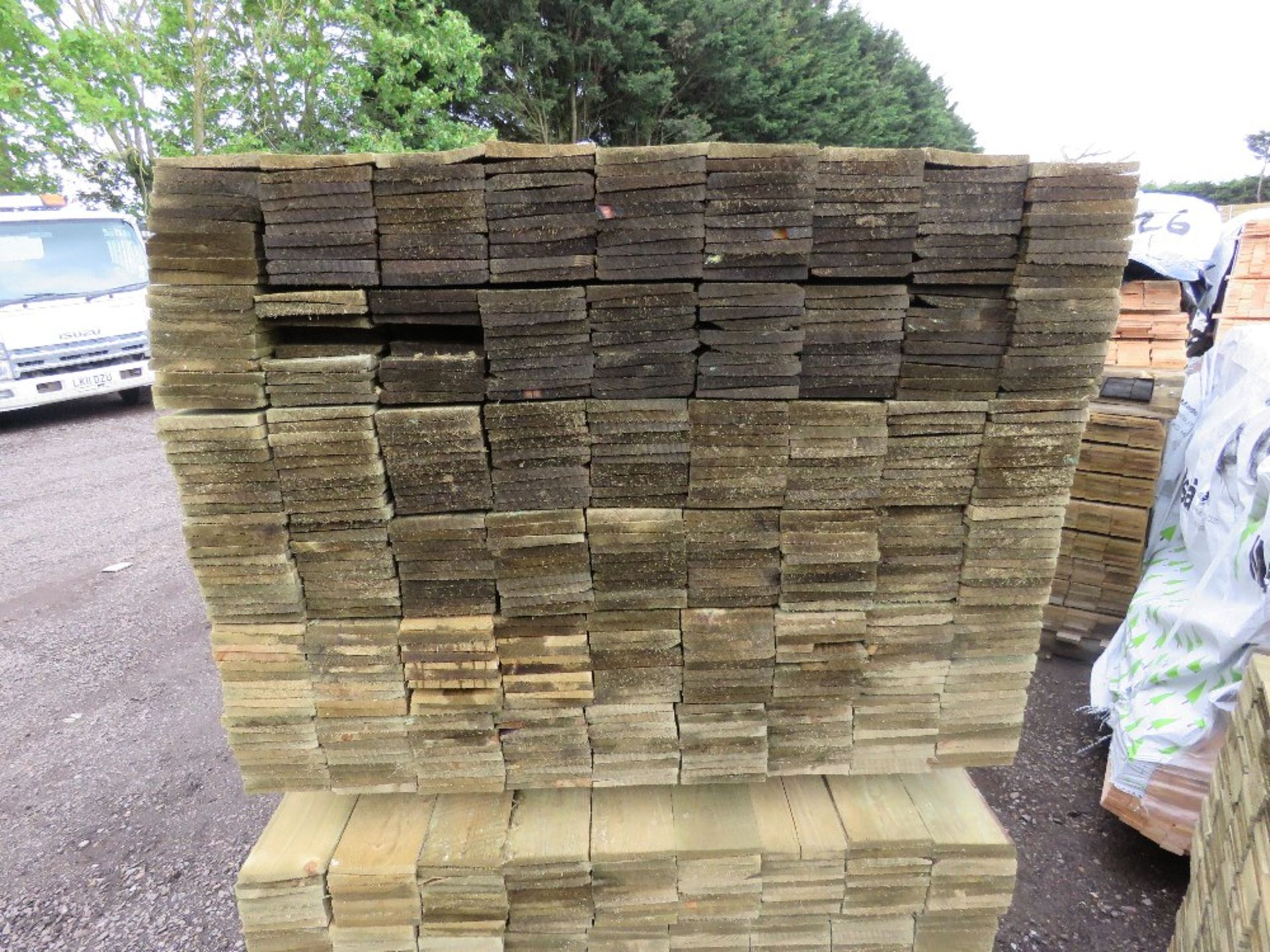 LARGE PACK OF TREATED FEATHER EDGE TIMBER CLADDING BOARDS, 1.80M LENGTH X 100MM WIDTH APPROX. - Image 2 of 3