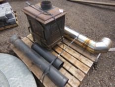 LOG BURNING STOVE WITH FLUE PIPES. THIS LOT IS SOLD UNDER THE AUCTIONEERS MARGIN SCHEME, THEREFOR