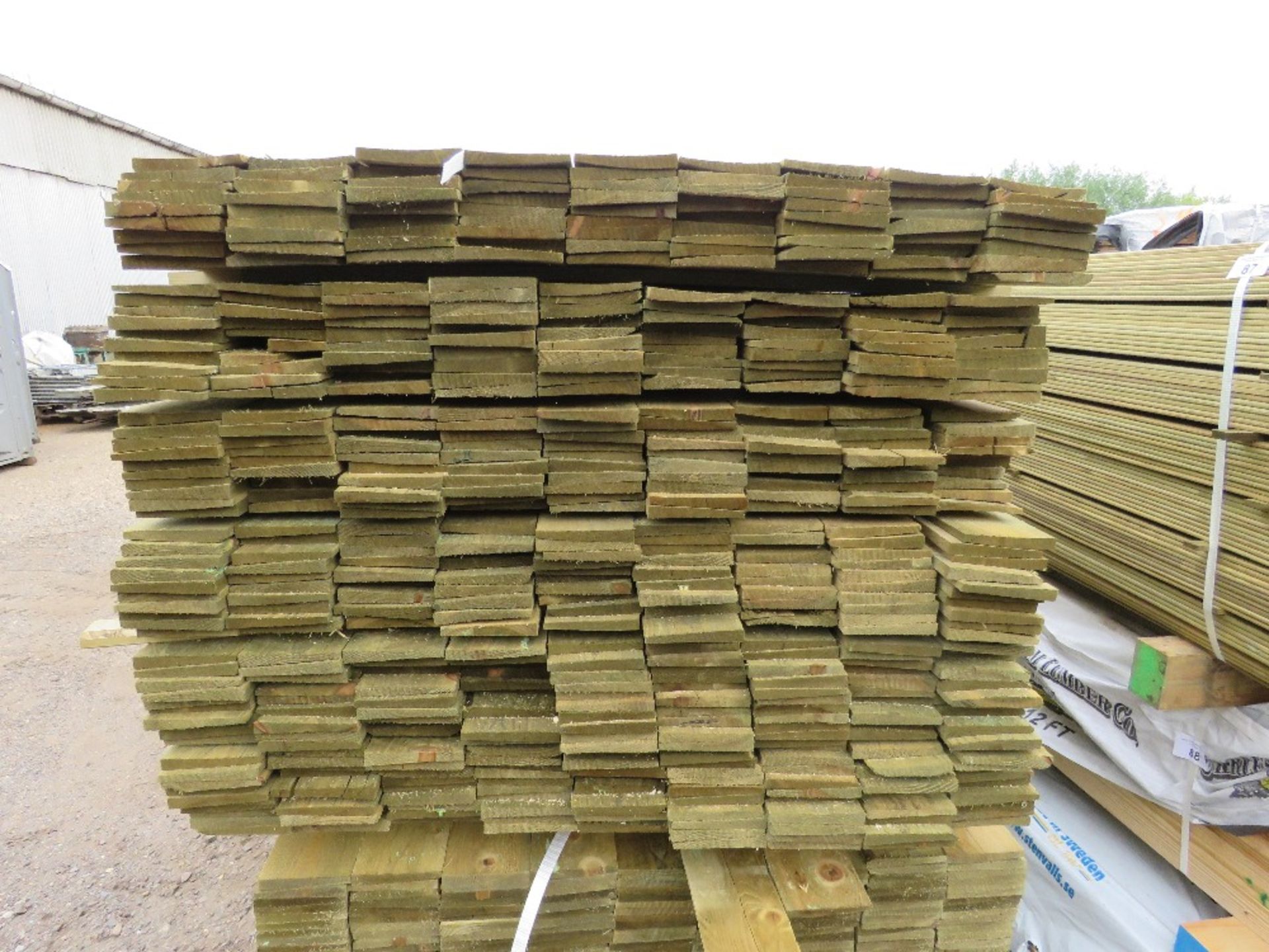 LARGE PACK OF TREATED FEATHER EDGE TIMBER CLADDING BOARDS. 1.8M LENGTH X 100MM WIDTH APPROX. - Image 2 of 2