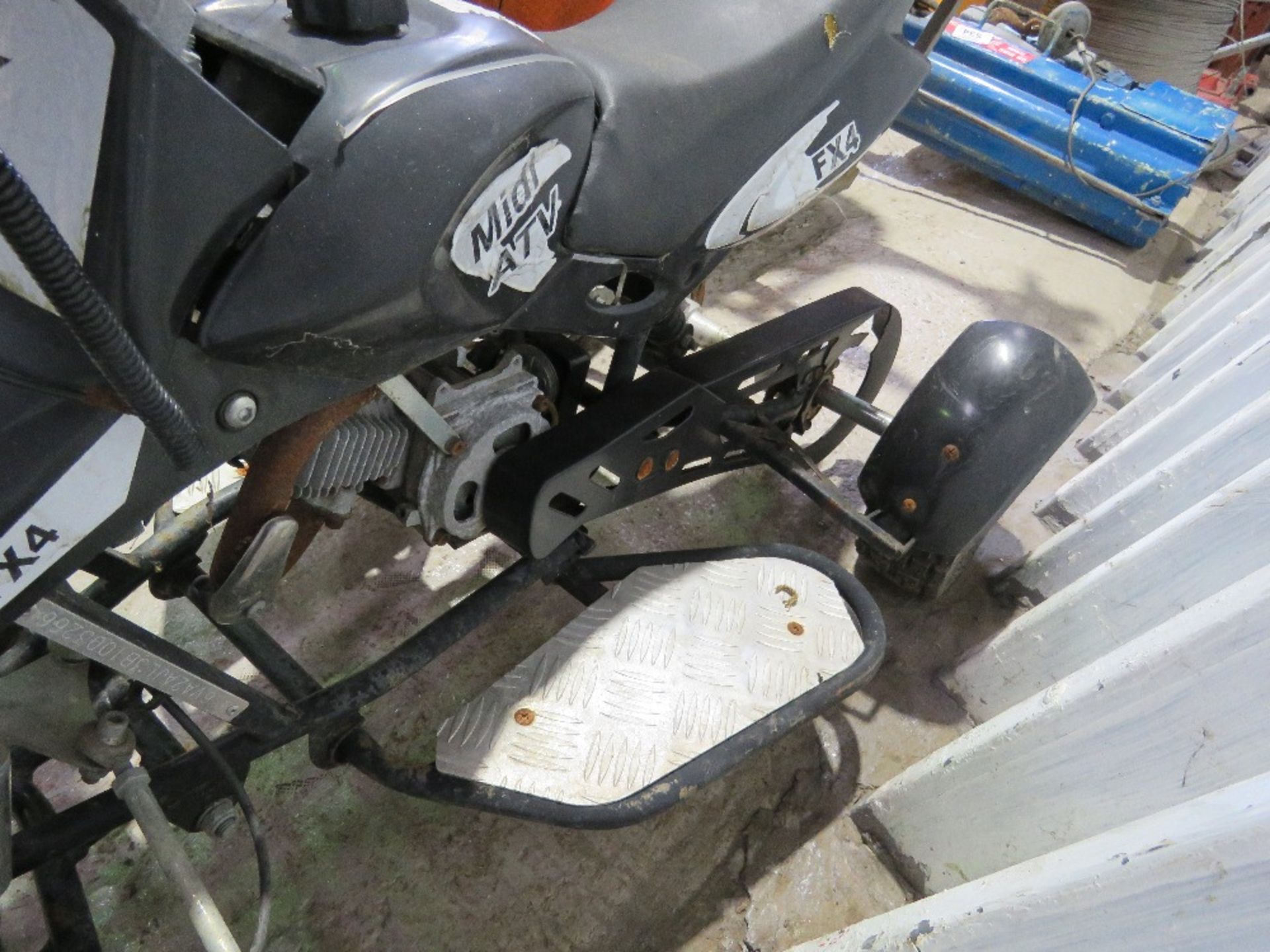 MINI PETROL ENGINED QUAD BIKE. FROM STORAGE, CONDITION UNKNOWN. THIS LOT IS SOLD UNDER THE AUCTION - Image 5 of 5