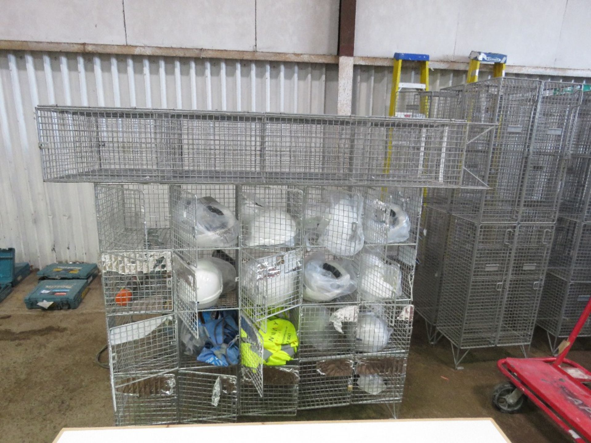 2 X MESH CAGE LOCKERS WITH CONTENTS. SOURCED FROM COMPANY LIQUIDATION. THIS LOT IS SOLD UNDER THE