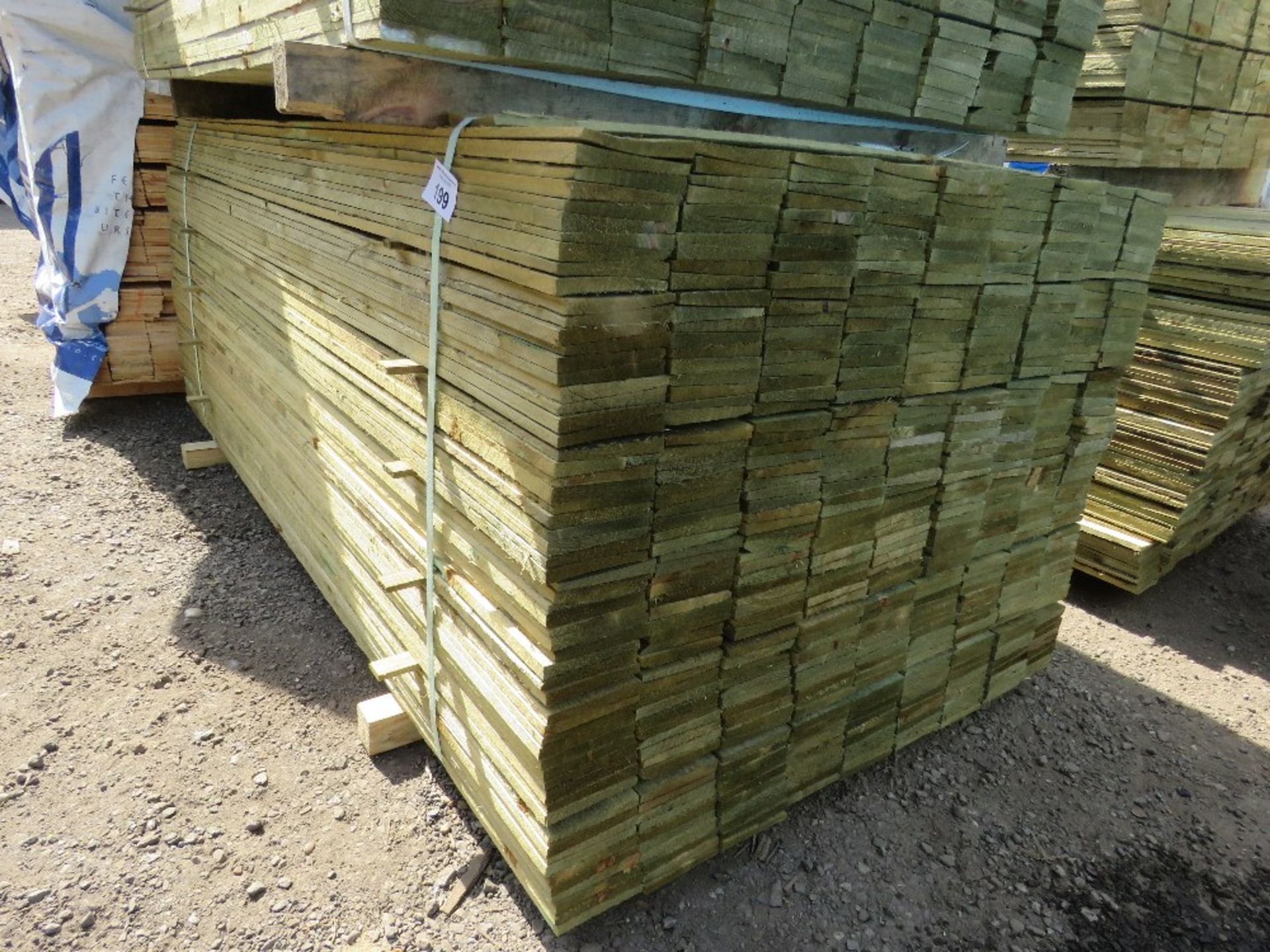 LARGE PACK OF TREATED FEATHER EDGE FENCE CLADDING BOARDS: 1.8M LENGTH X 100MM WIDTH APPROX.