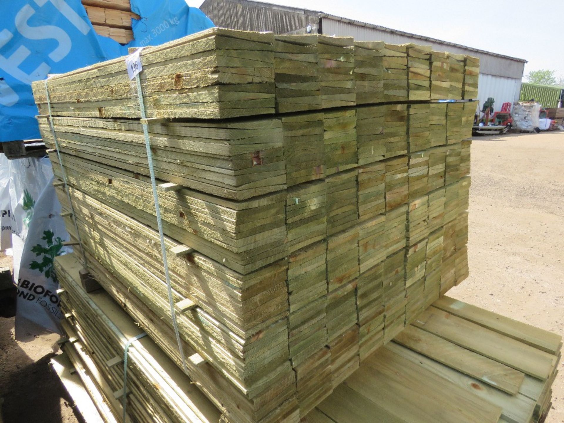 LARGE PACK OF TREATED FEATHER EDGE FENCE CLADDING BOARDS: 1.2M LENGTH X 100MM WIDTH APPROX.