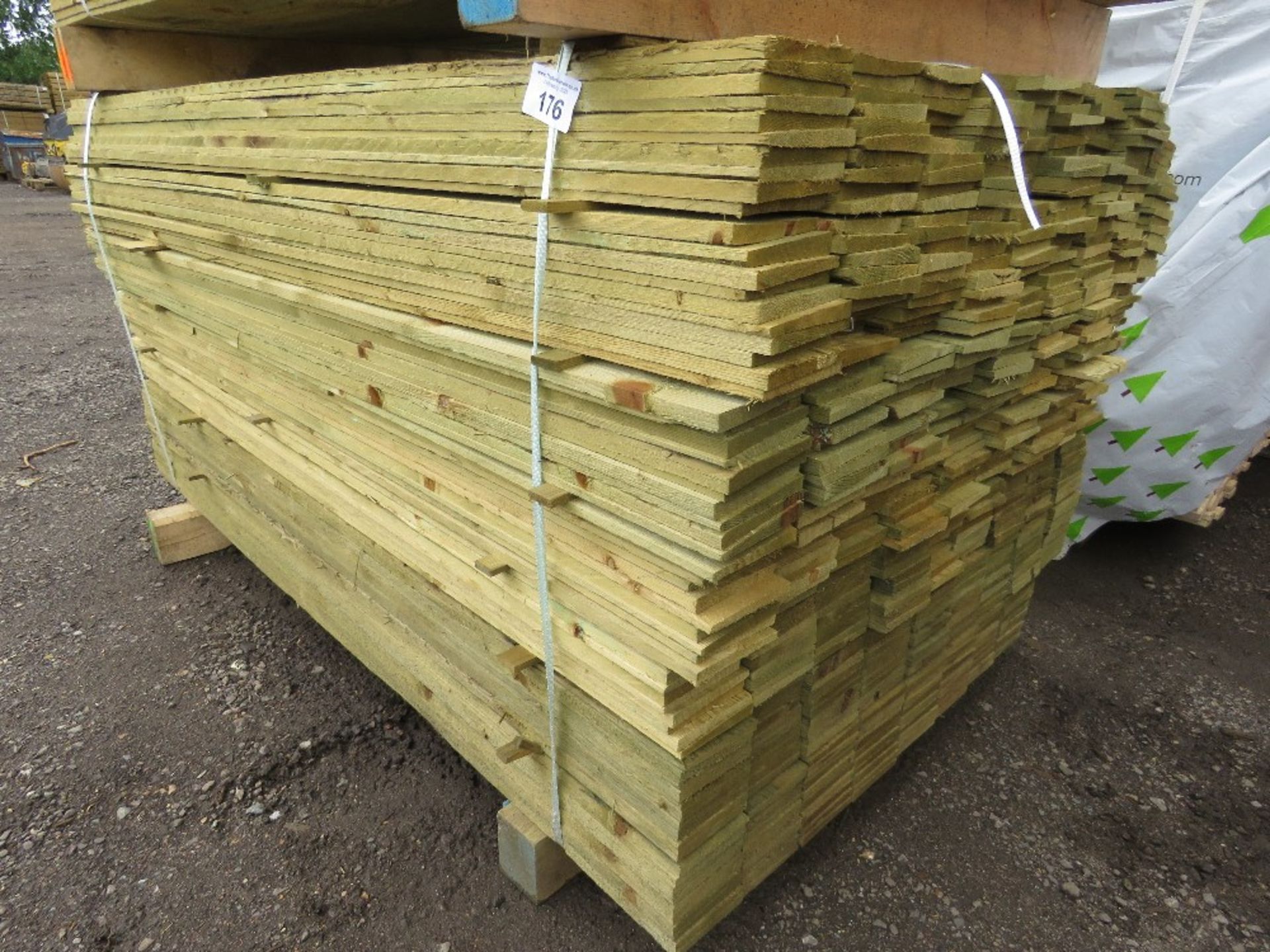 LARGE PACK OF TREATED FEATHER EDGE TIMBER CLADDING BOARDS, 1.65M LENGTH X 100MM WIDTH APPROX.