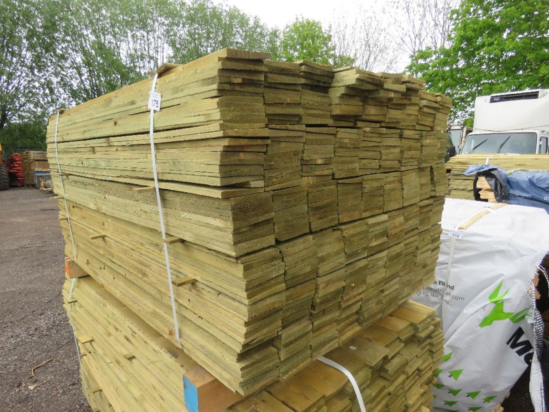 LARGE PACK OF TREATED FEATHER EDGE TIMBER CLADDING BOARDS, 1.5M LENGTH X 100MM WIDTH APPROX.