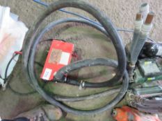 BATTERY POWERED DIESEL TRANSFER PUMP WITH A HOSE.
