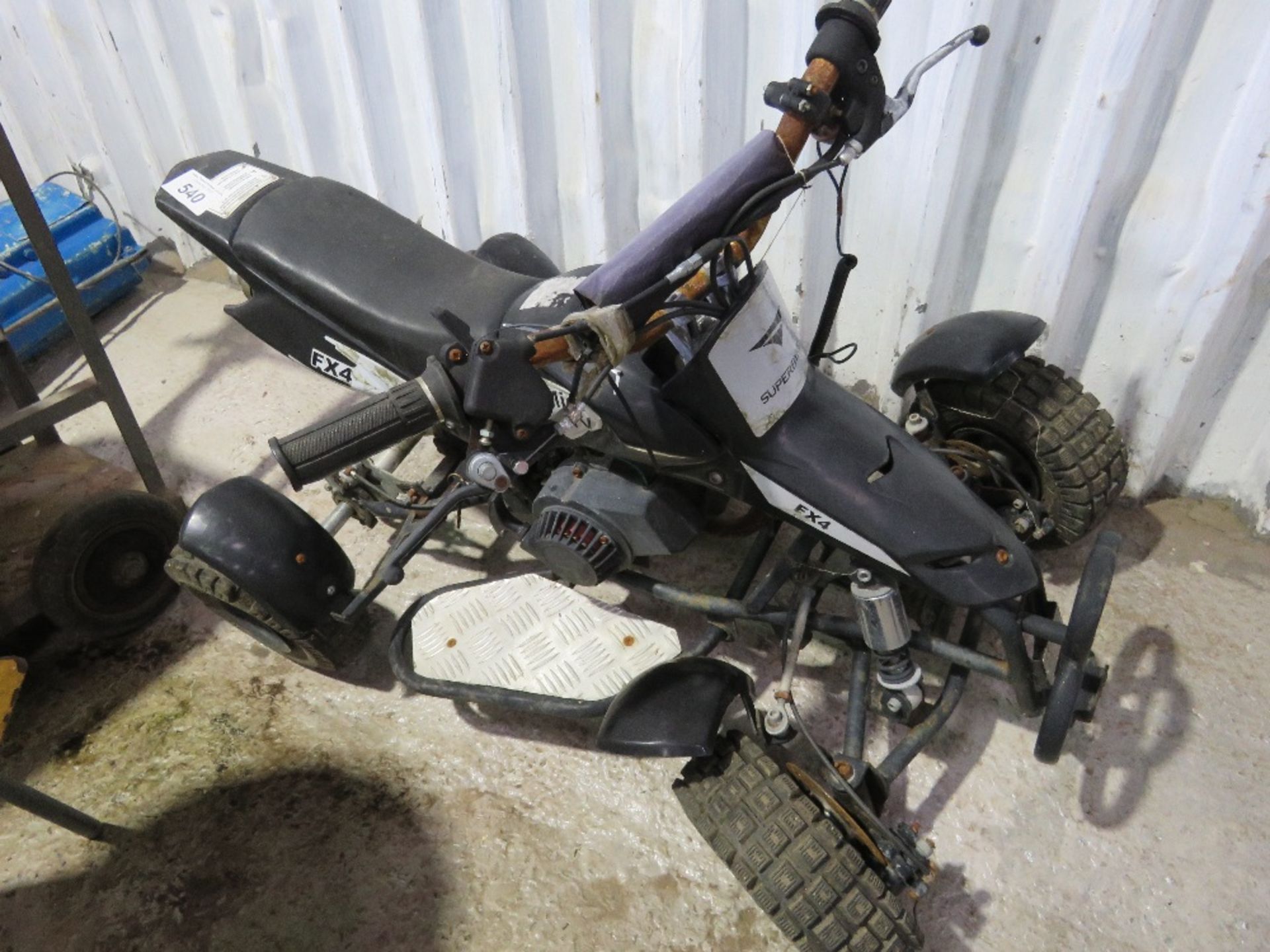 MINI PETROL ENGINED QUAD BIKE. FROM STORAGE, CONDITION UNKNOWN. THIS LOT IS SOLD UNDER THE AUCTION