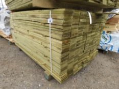 LARGE PACK OF TREATED FEATHER EDGE TIMBER CLADDING BOARDS. 1.65M LENGTH X 100MM WIDTH APPROX.