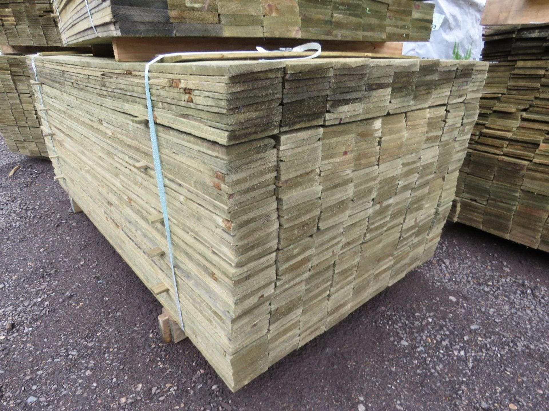 LARGE PACK OF TREATED FEATHER EDGE TIMBER CLADDING BOARDS, 1.80M LENGTH X 100MM WIDTH APPROX.