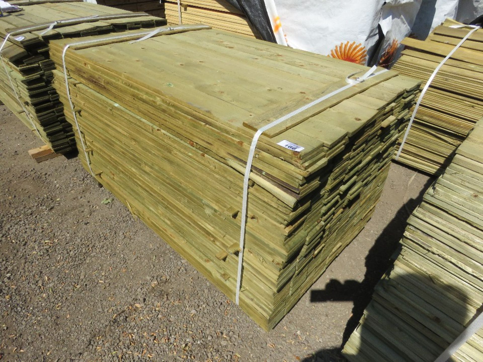 LARGE PACK OF TREATED FEATHER EDGE TIMBER CLADDING BOARDS: 1.5M LENGTH X 100MM WIDTH APPROX. - Image 2 of 4