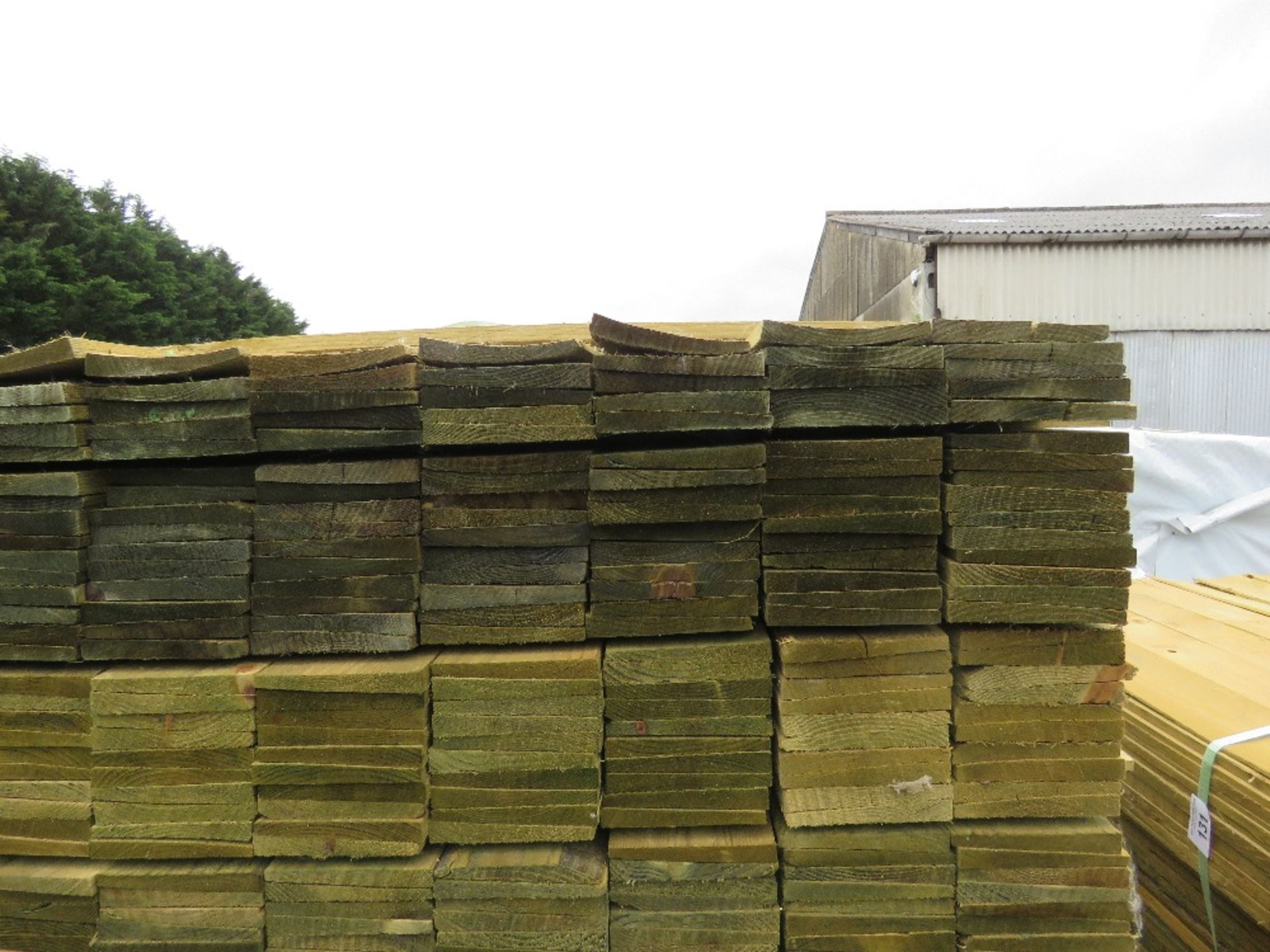 LARGE PACK OF TREATED FEATHER EDGE TIMBER CLADDING BOARDS, 1.35M LENGTH X 100MM WIDTH APPROX. - Image 3 of 3