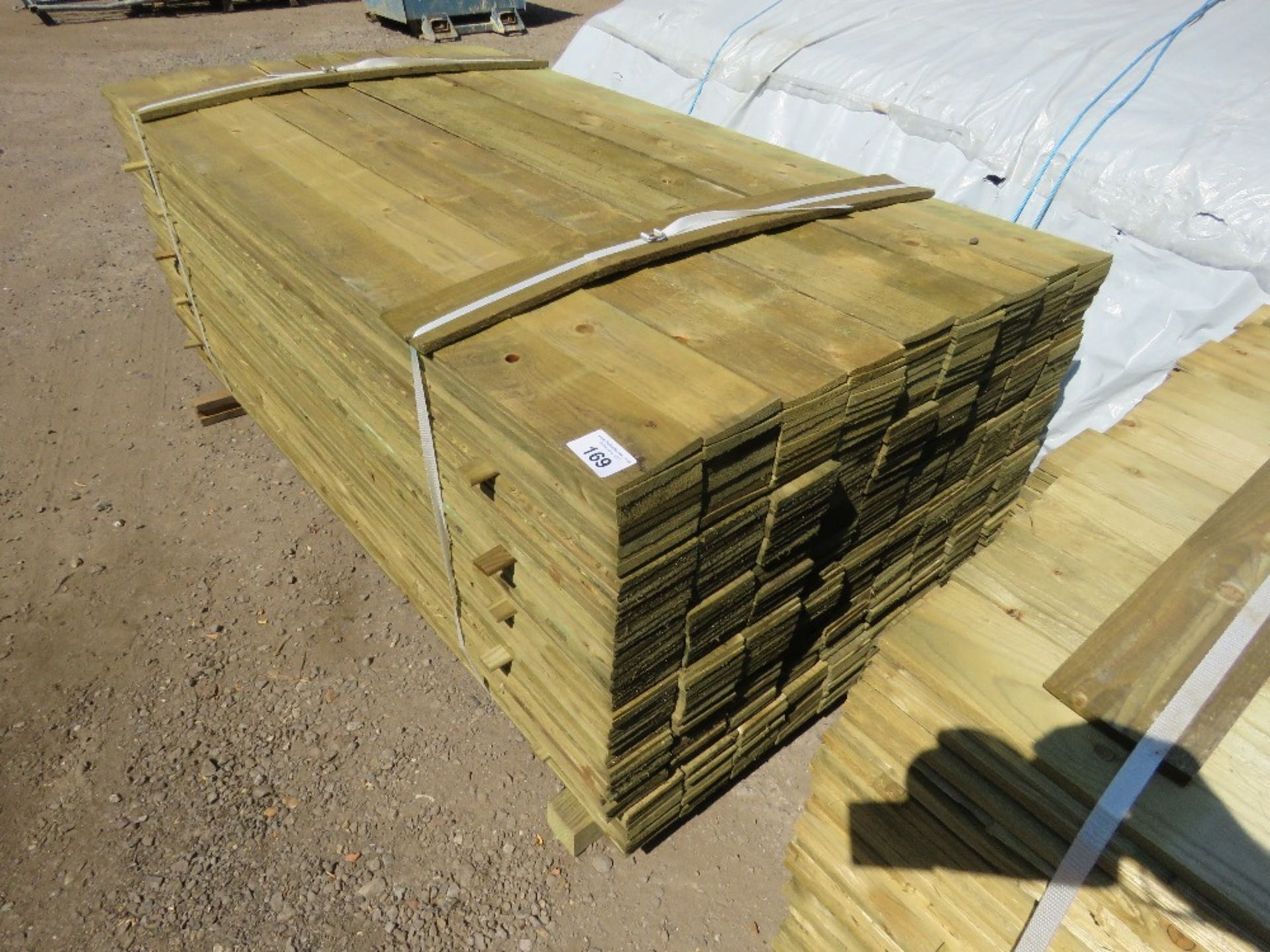 LARGE PACK OF TREATED FEATHER EDGE TIMBER CLADDING BOARDS: 1.8M LENGTH X 100MM WIDTH APPROX. - Image 2 of 4