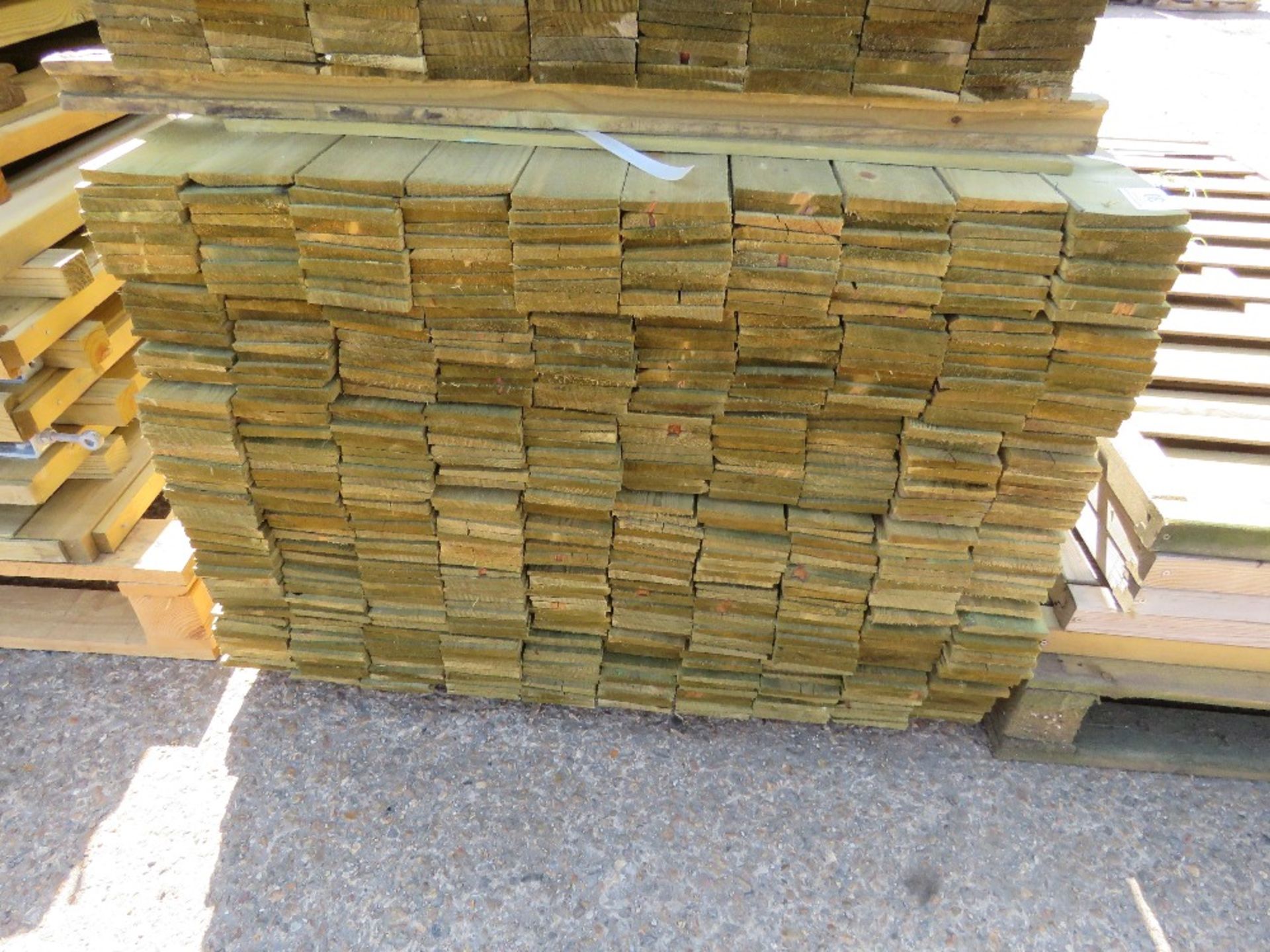 LARGE PACK OF TREATED FEATHER EDGE TIMBER CLADDING BOARDS: 1.8M LENGTH X 100MM WIDTH APPROX. - Image 2 of 4