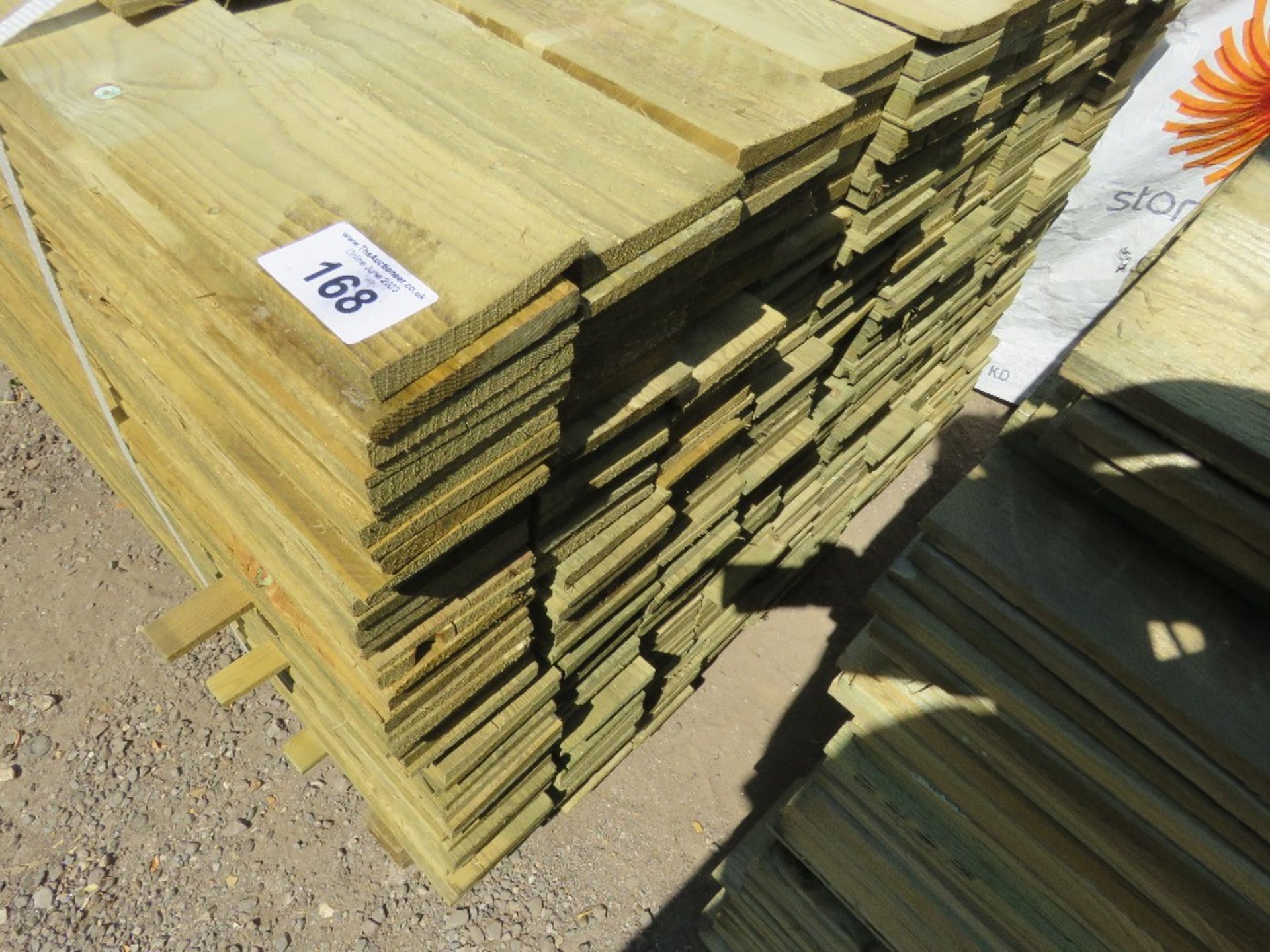 LARGE PACK OF TREATED FEATHER EDGE TIMBER CLADDING BOARDS: 1.8M LENGTH X 100MM WIDTH APPROX. - Image 3 of 4