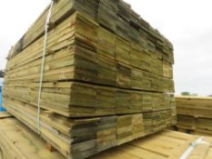 LARGE PACK OF TREATED FEATHER EDGE TIMBER CLADDING BOARDS, 1.35M LENGTH X 100MM WIDTH APPROX.