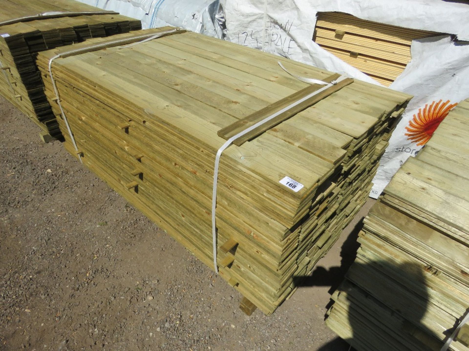LARGE PACK OF TREATED FEATHER EDGE TIMBER CLADDING BOARDS: 1.8M LENGTH X 100MM WIDTH APPROX. - Image 2 of 4