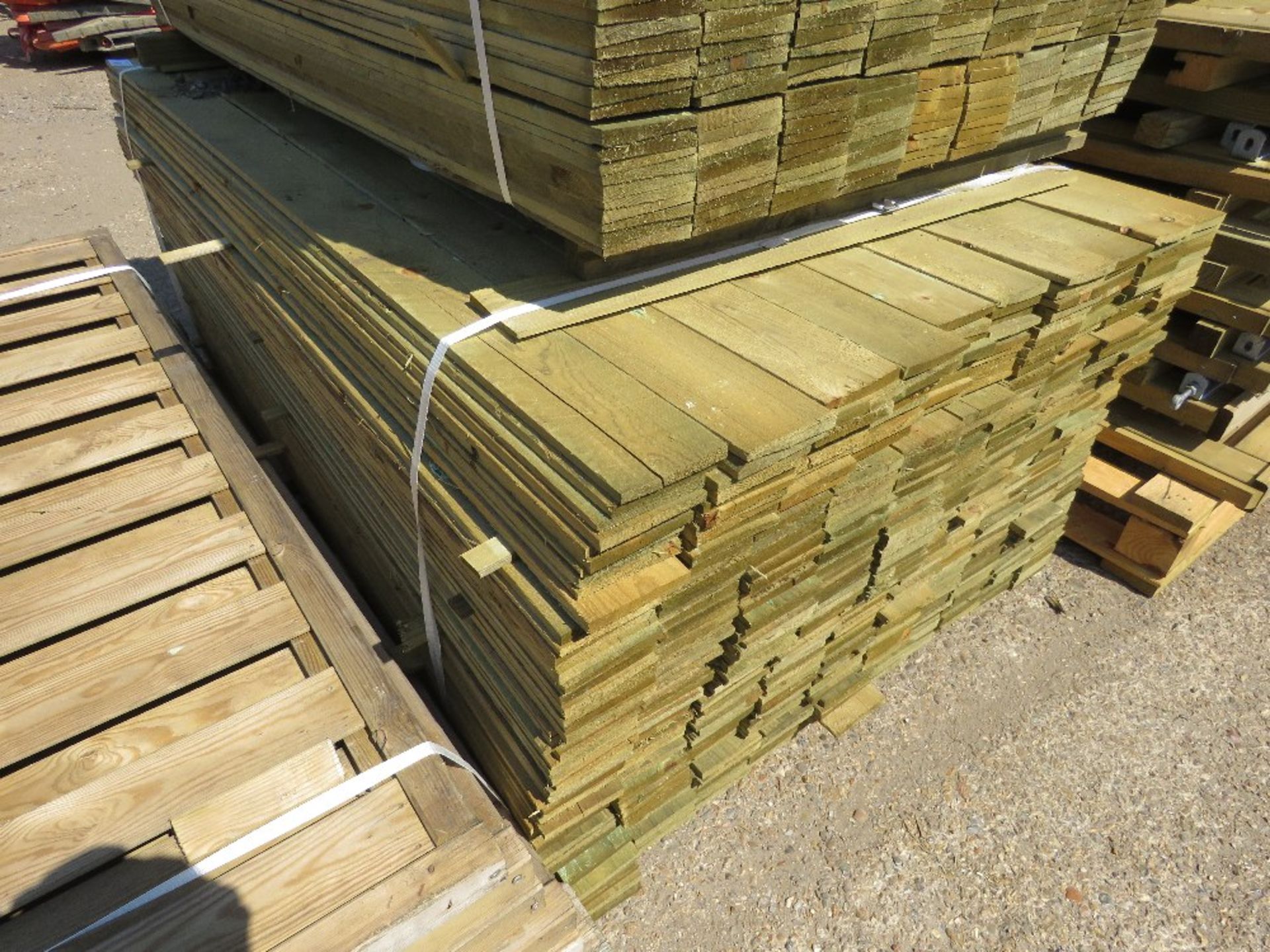 LARGE PACK OF TREATED FEATHER EDGE TIMBER CLADDING BOARDS: 1.8M LENGTH X 100MM WIDTH APPROX. - Image 4 of 4