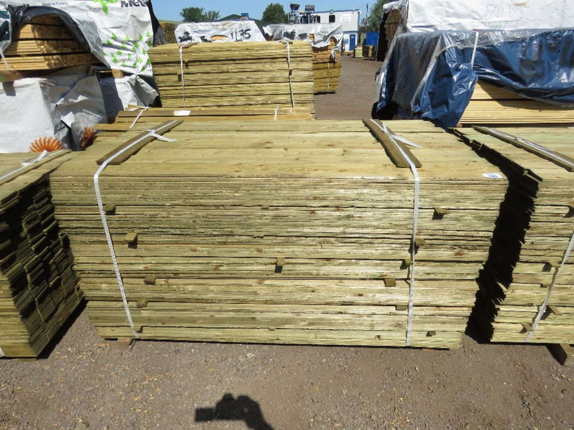 LARGE PACK OF TREATED FEATHER EDGE TIMBER CLADDING BOARDS: 1.8M LENGTH X 100MM WIDTH APPROX.