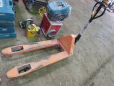 PALLET TRUCK WITH A DAMAGED WHEEL.