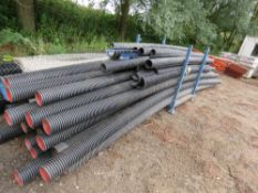 LARGE STILLAGE OF ASSORTED PLASTIC DUCTING/DRAINAGE PIPES UP TO 18FT LENGTH APPROX.