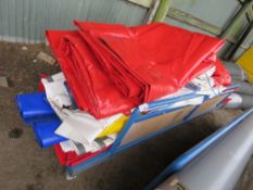 BOARD TROLLEY CONTAINING ASSORTED TARPULIN SHEETS AND PLASTIC CURTAIN MATERIAL. THIS LOT IS SOLD
