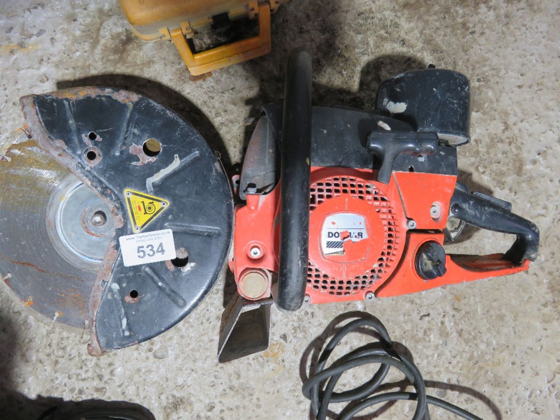 DOLMAR PETROL SAW WITH A BLADE. THIS LOT IS SOLD UNDER THE AUCTIONEERS MARGIN SCHEME, THEREFORE N