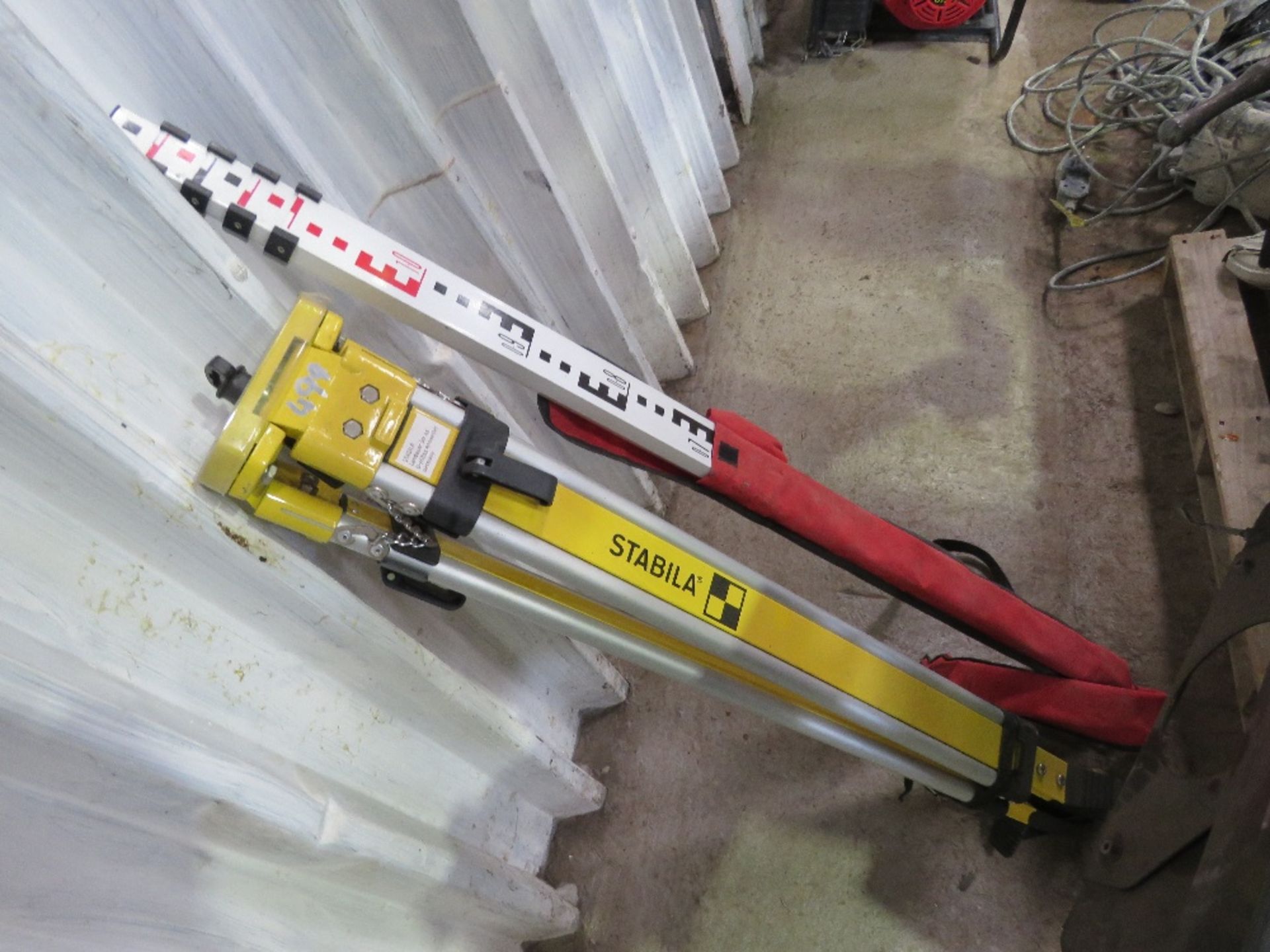 STABILA SURVEY TRIPOD PLUS A MEASURING STAFF.