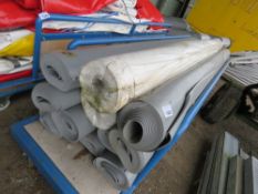 BOARD TROLLEY CONTAINING ASSORTED PLASTIC CURTAIN MATERIAL, MAINLY GREY COLOURED. THIS LOT IS SOL