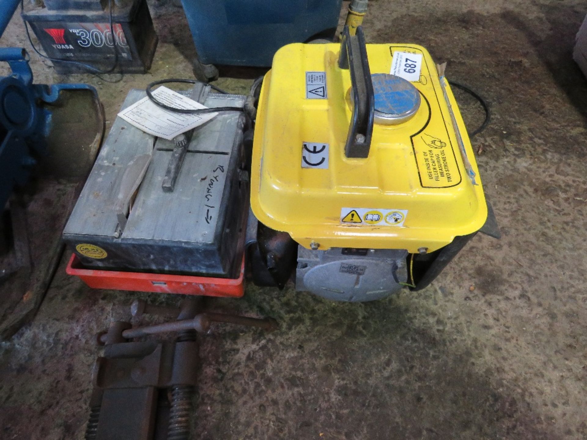SMALL SIZED PORTABLE GENERATOR PLUS A TILE SAW. THIS LOT IS SOLD UNDER THE AUCTIONEERS MARGIN SCH