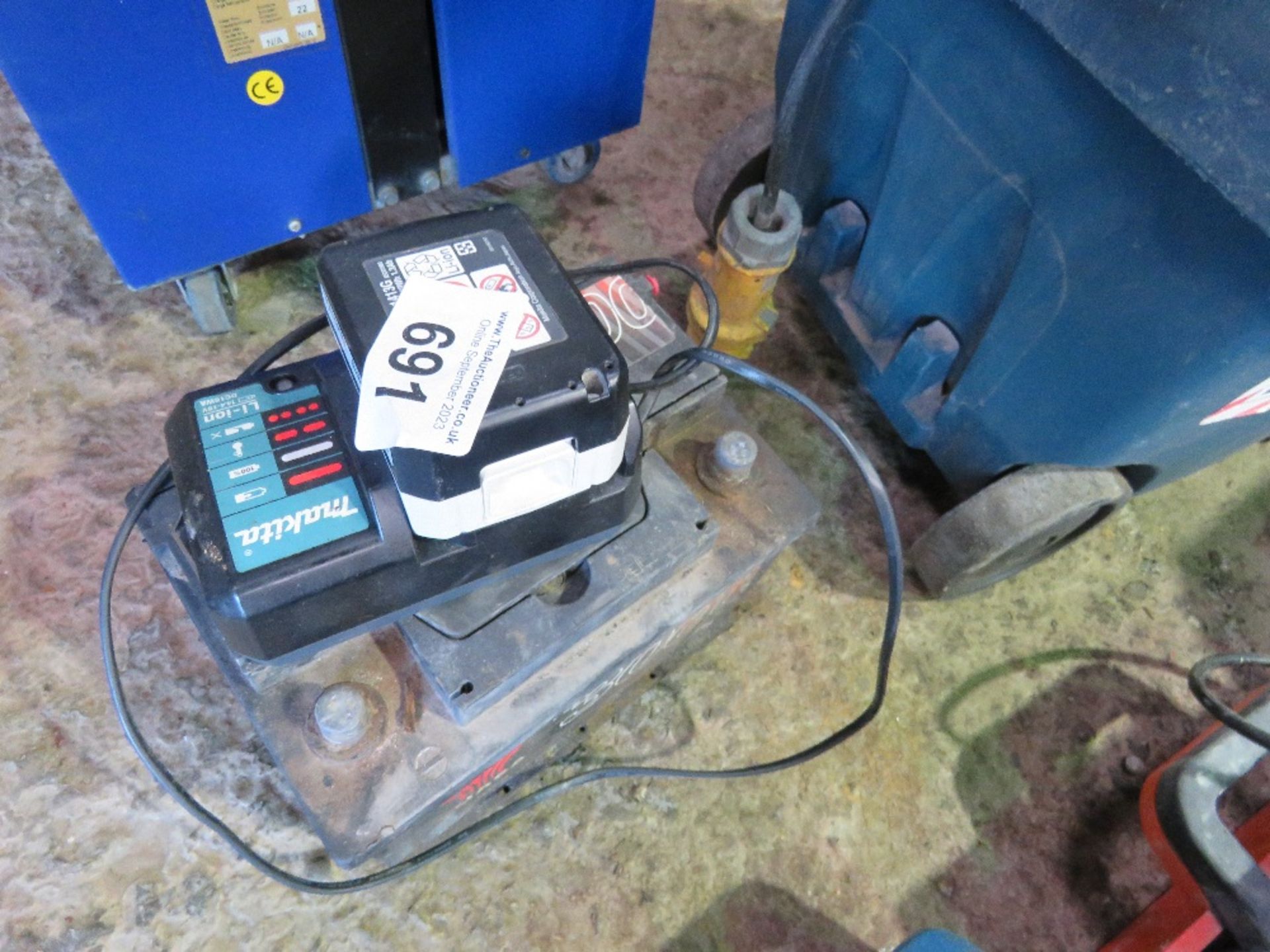CAR BATTERY WITH A MAKITA BATTERY PLUS CHARGER.